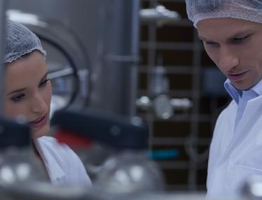 process industry male and female with hair nets